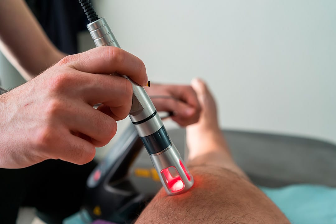 Class IV Laser Therapy over knee. treatment physiotherapy