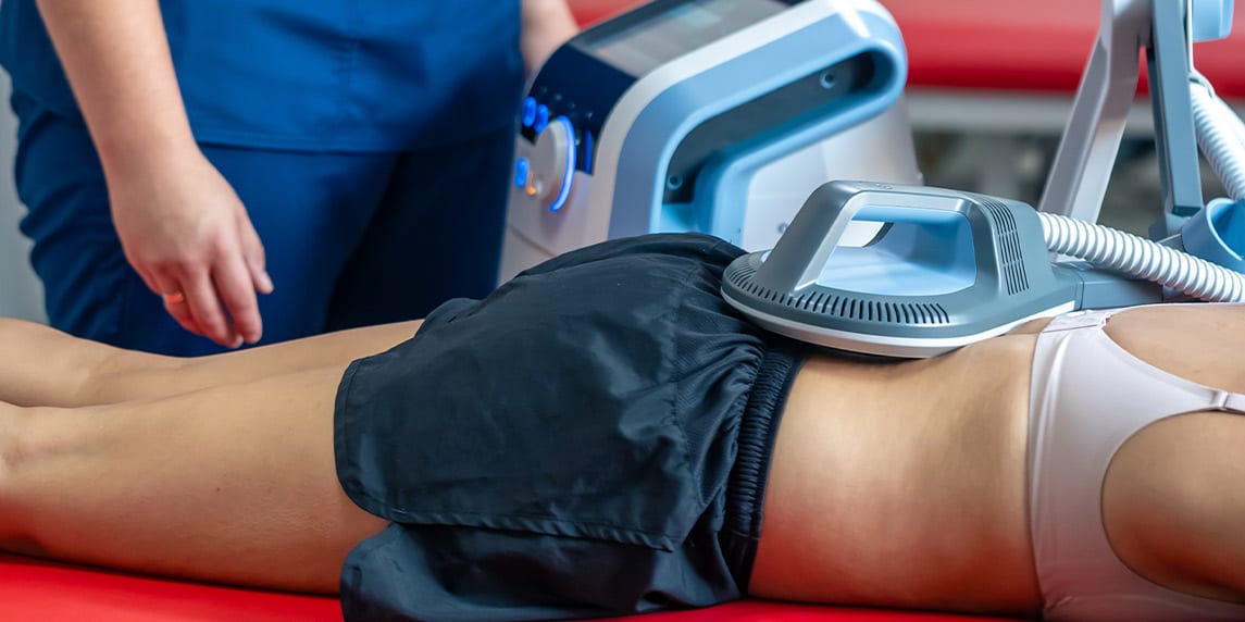 A doctor provides a body massage to a woman, highlighting the benefits of physical therapy for health.